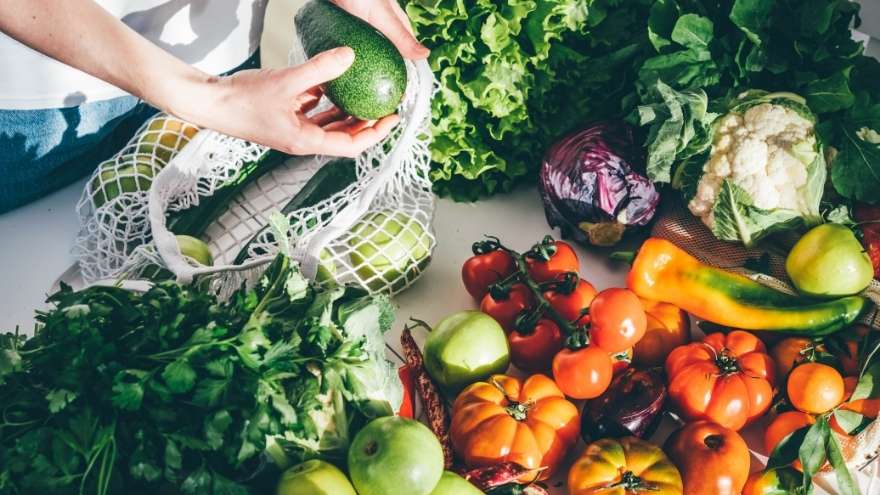 Woman takes fresh organic vegetables