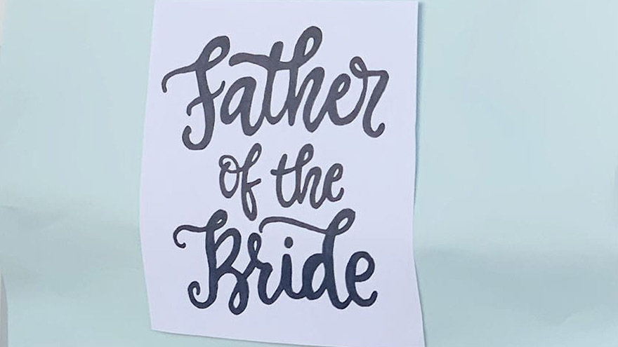 Father of the bride sign on the end of the hospital bed