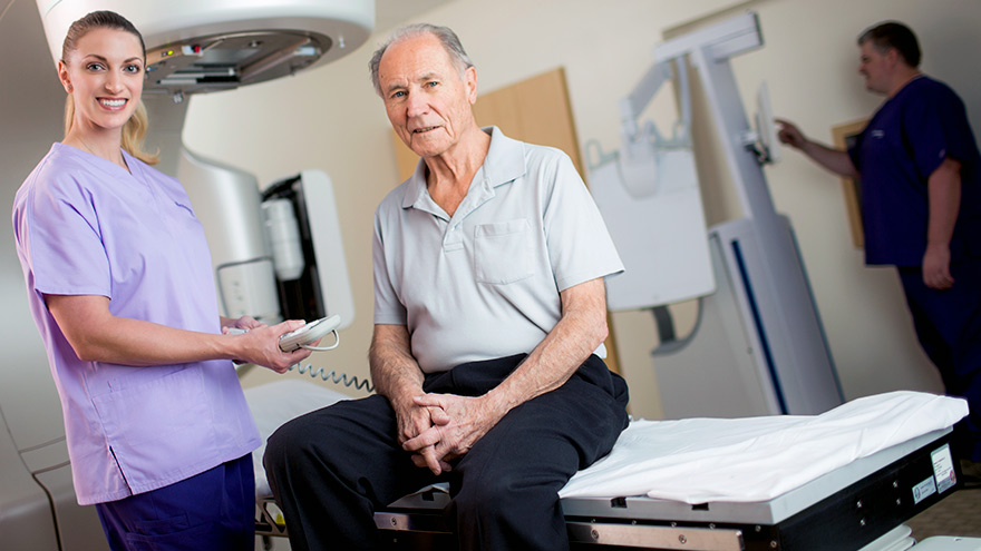 Renown Health imaging technician assisting patient during scan